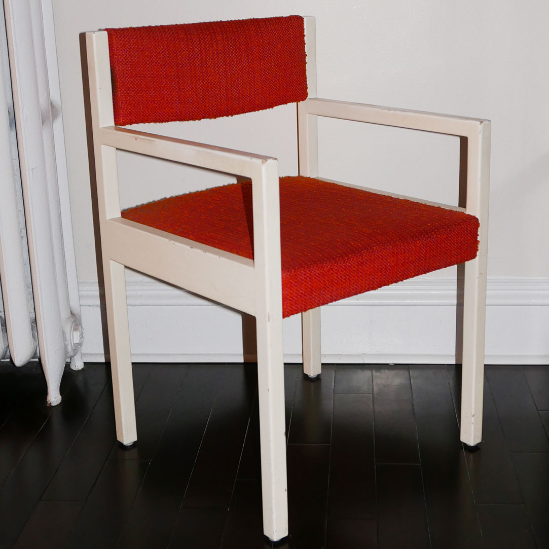 mid century chair with orange upholstery