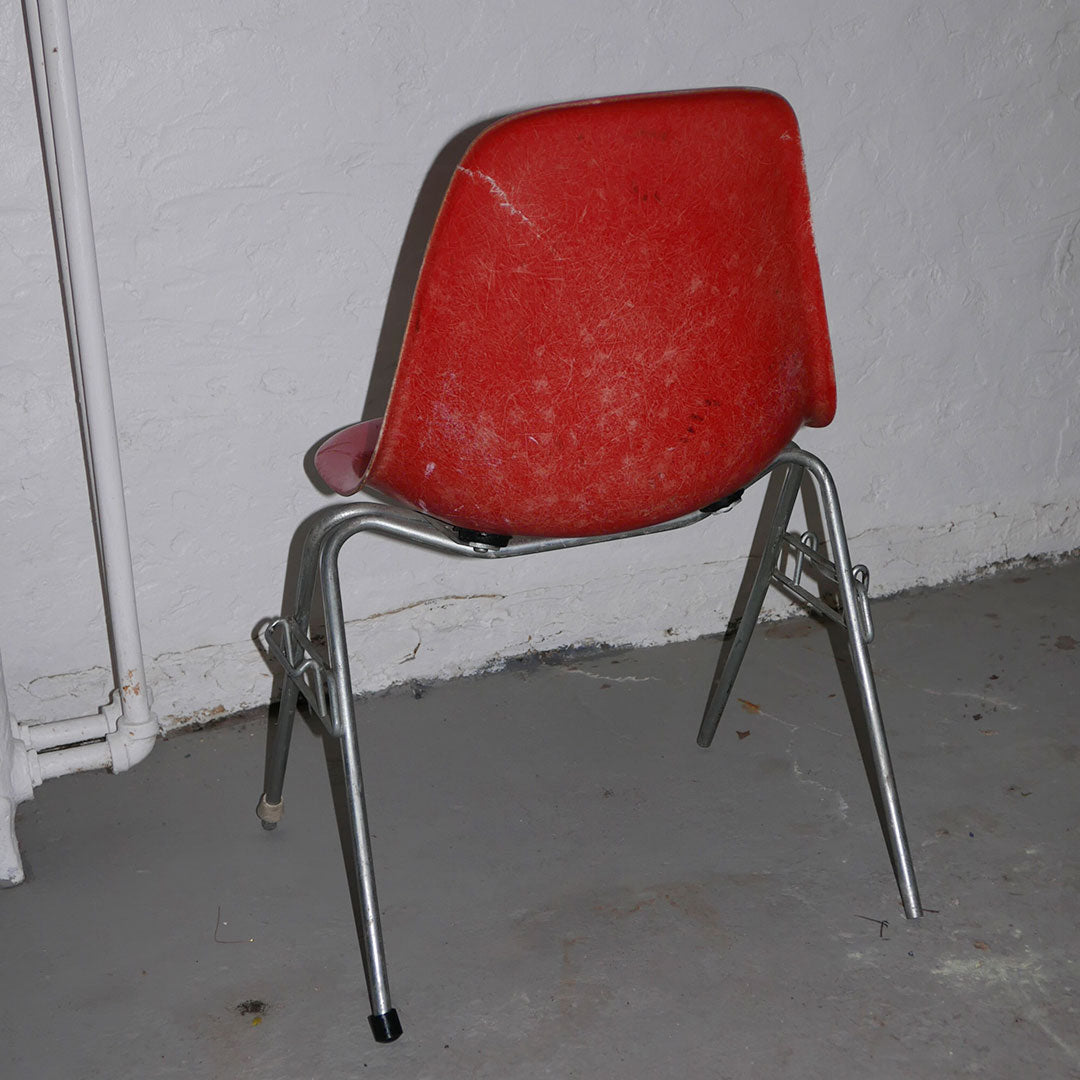 orange herman miller fiberglass shell chair