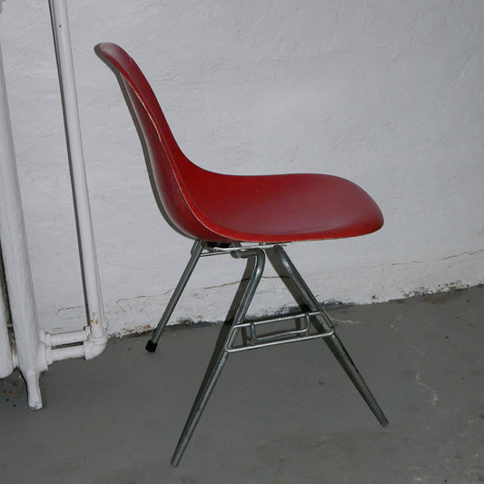 orange herman miller fiberglass shell chair