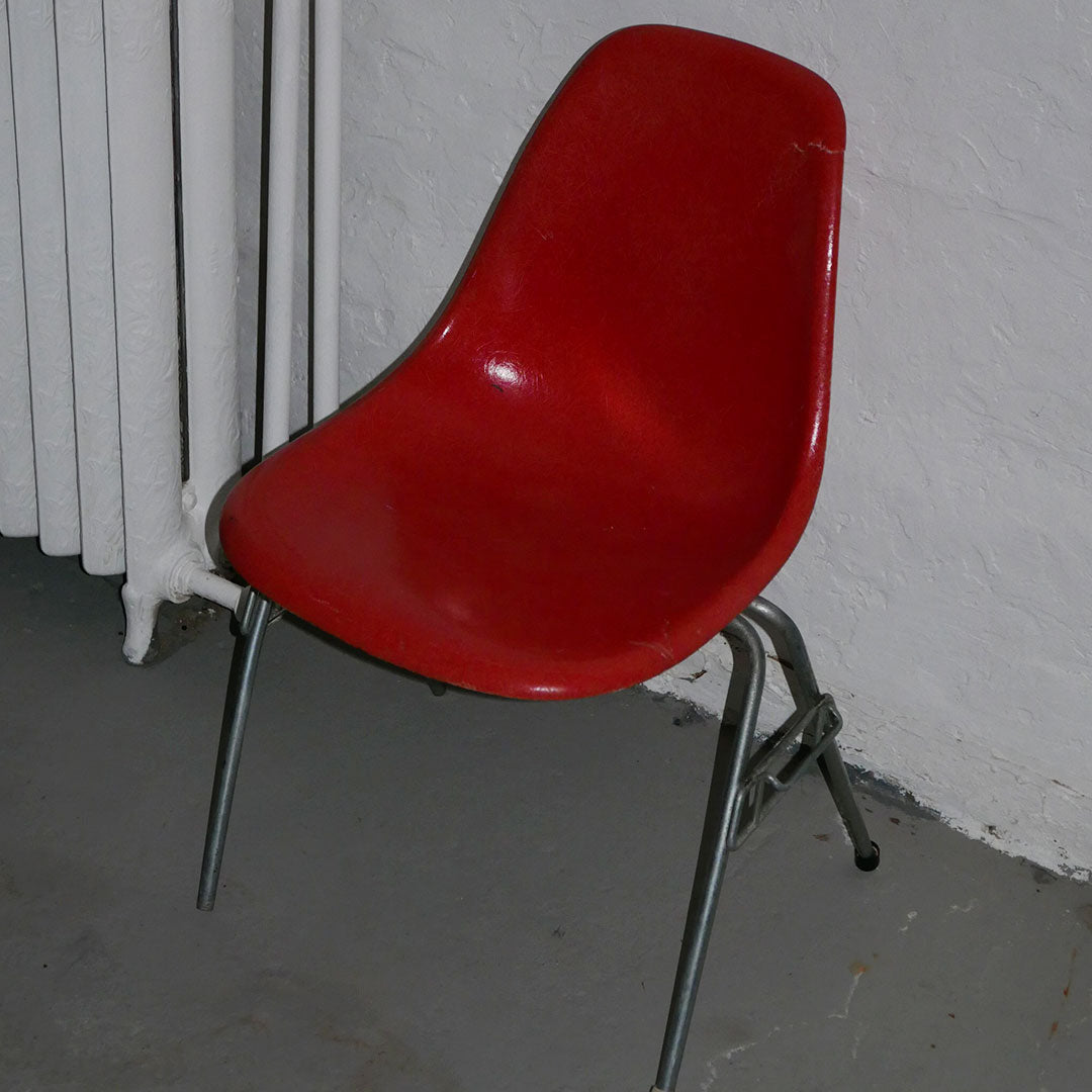 orange herman miller fiberglass shell chair