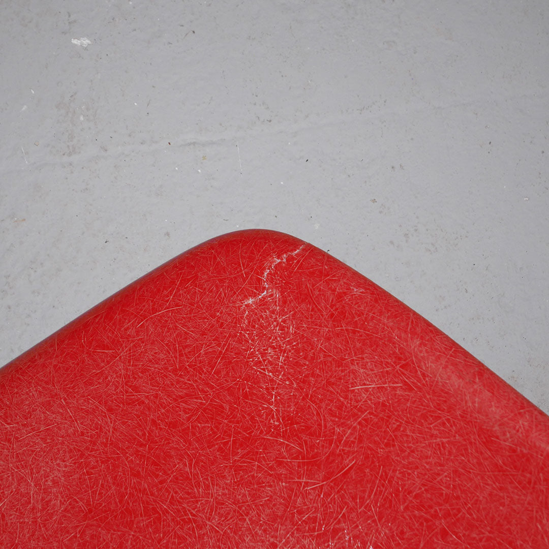 orange herman miller fiberglass shell chair