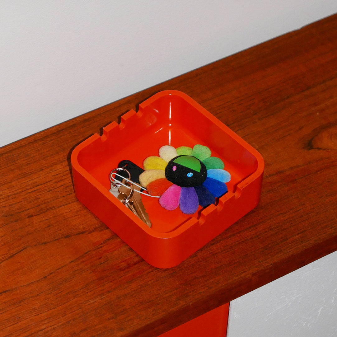 plastic orange ashtray
