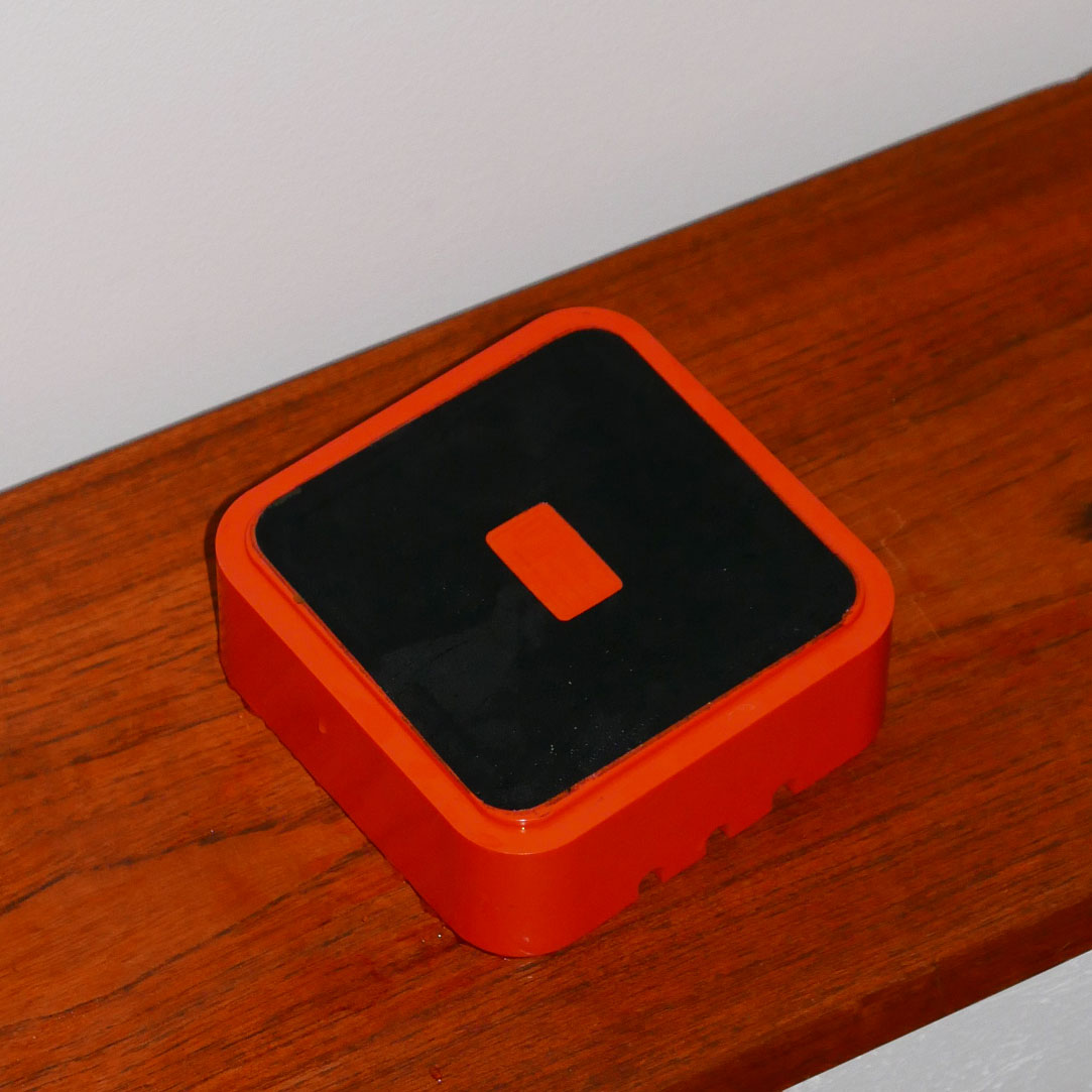 plastic orange ashtray