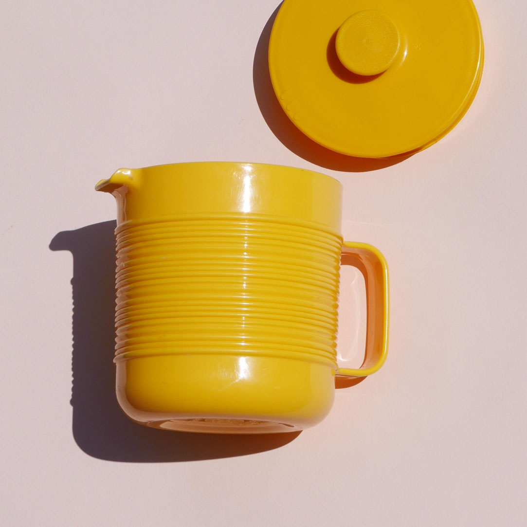 yellow plastic pitcher