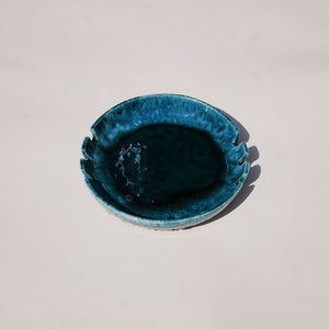 mid century round drip glaze ashtray in teal. made in canada.