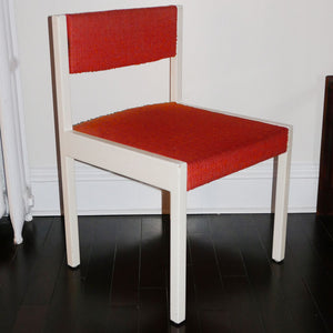 mid century chair with orange upholstery