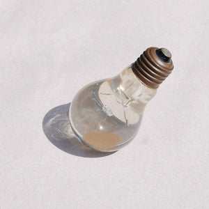 lucite light bulb paperweight