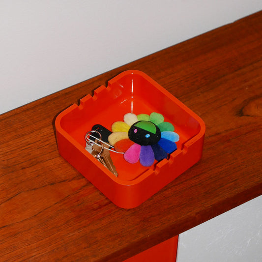 plastic orange ashtray