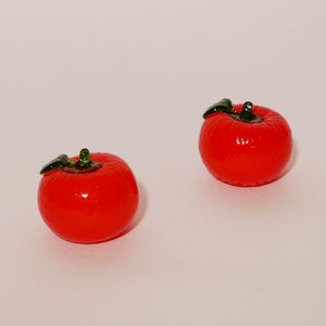 pair of decorative glass tomatoes