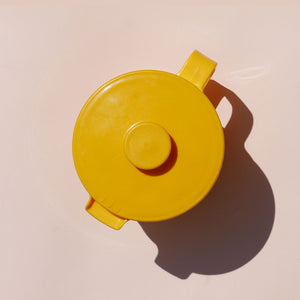 yellow plastic pitcher